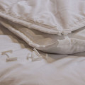 HUESLER NEST Couette 4 saisons en laine de mouton 